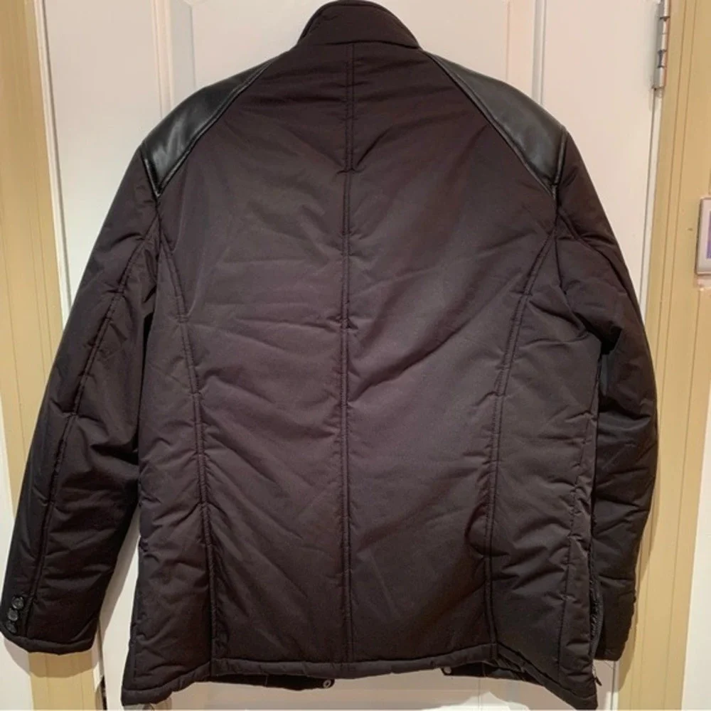 PRONTO UOMO. NWOT. Black jacket w/faux leather trim on shoulder. Three pockets.